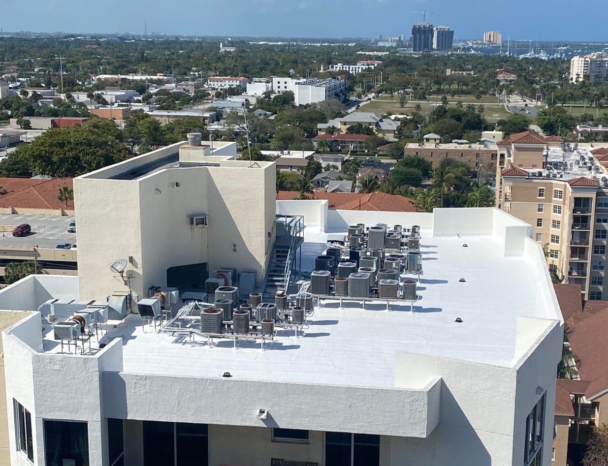 Aerial view of a maintained commercial roof with rooftop mechanical units