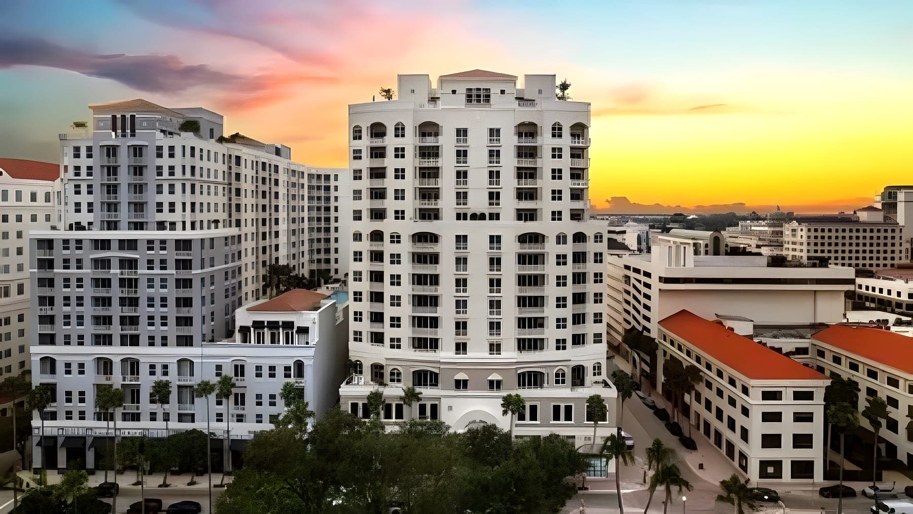 A downtown West Palm Beach tower at dusk beneath an evening sky