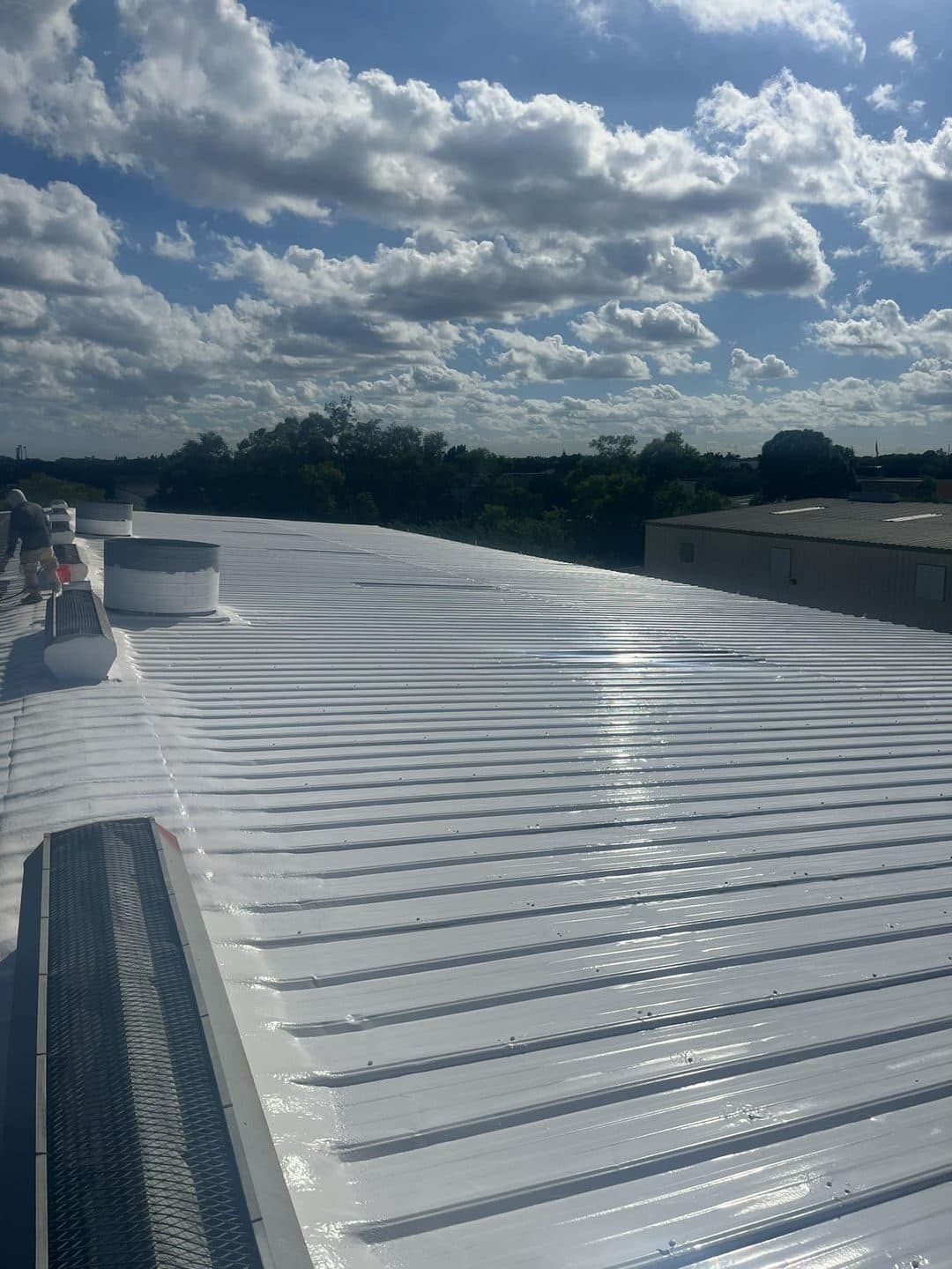 A completed coating on a standing-seam metal roof