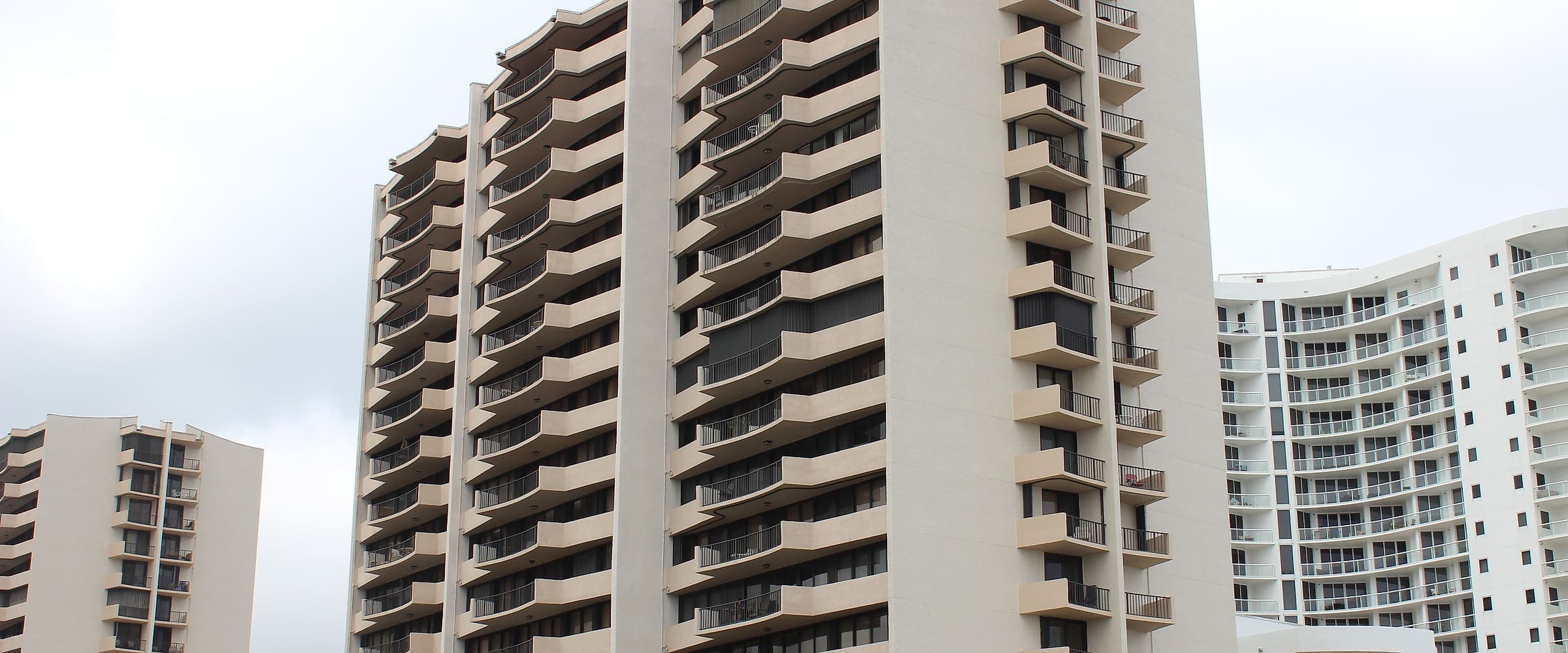 Oceanfront condominium towers with balconies along each floor
